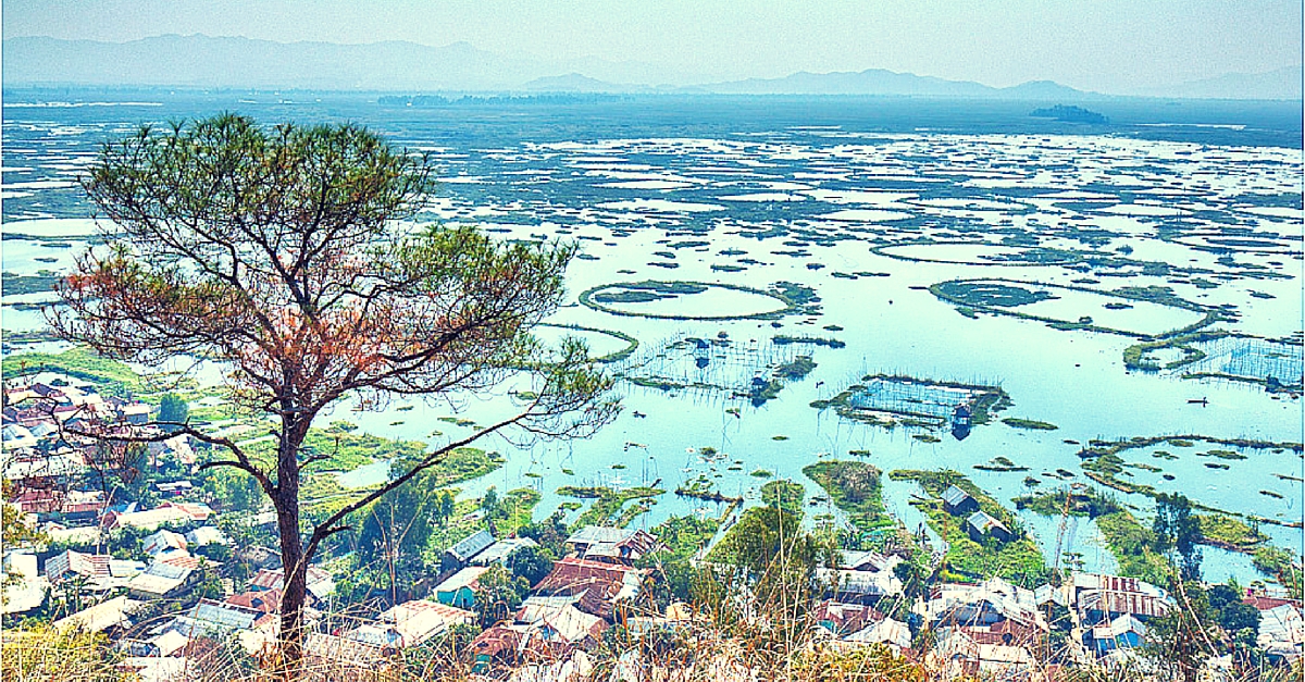 Loktak Lake, Manipur – Floating Worlds in the Rain. Northeast India Travel. Rainy season clouds over Loktak Lake, Manipur